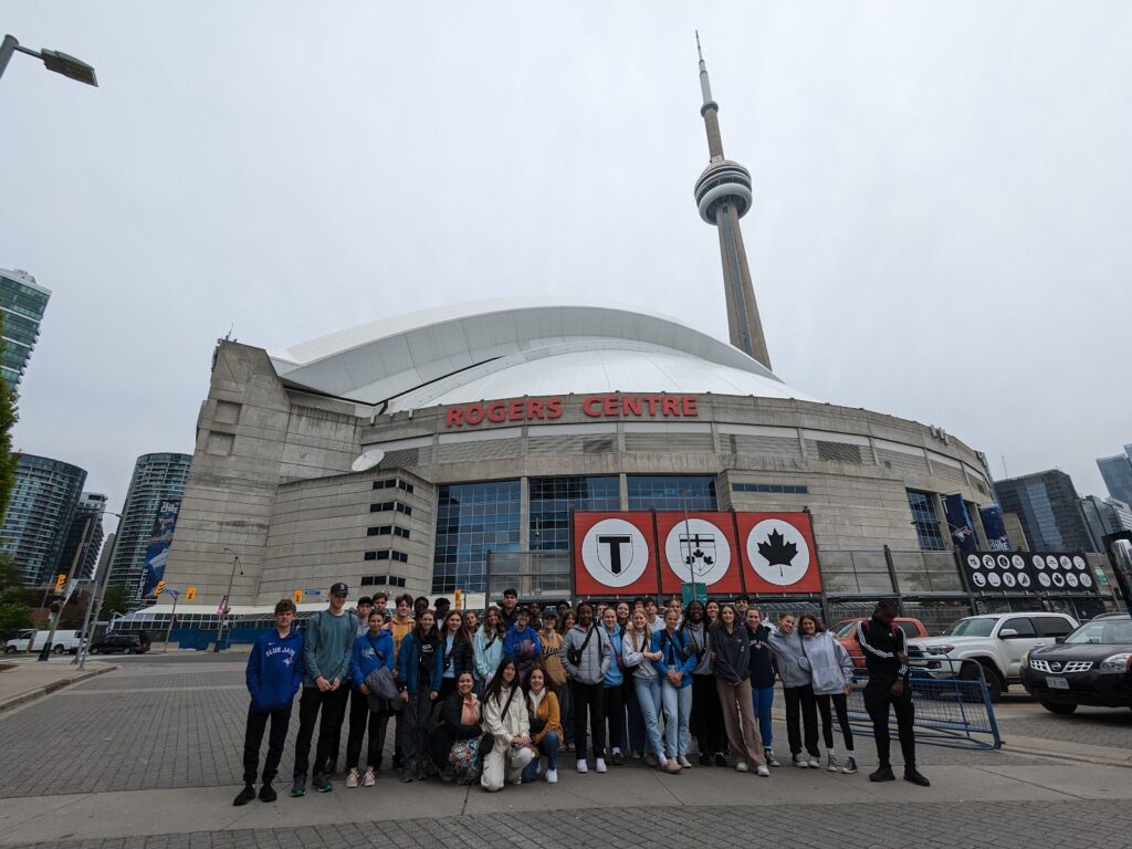 Group of students at Fredericton Christian Academy in front of Rogers Center in Toronto during cultural exchange in Canada.