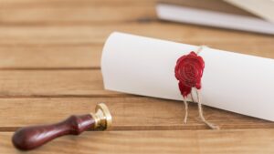 Documento enrolado com selo de cera vermelha representando carta oficial LOA para intercâmbio